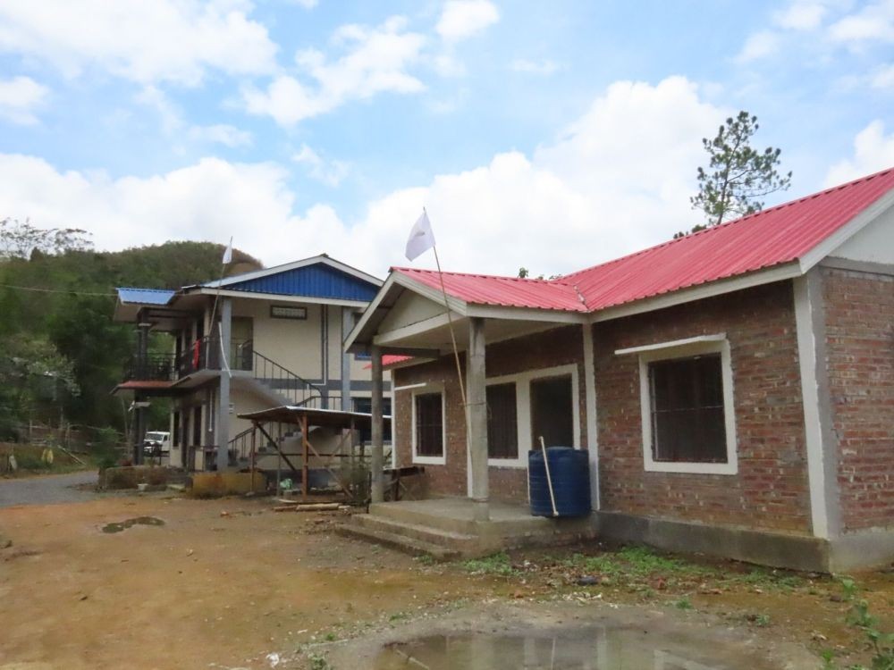 White flags are seen hoisted above houses in H Wajang village in Chandel district of Manipur in this photos provided the PRO Defence. The flag, among others, symbolises ‘reassurance, peace, and harmony, maintains the PRO.
